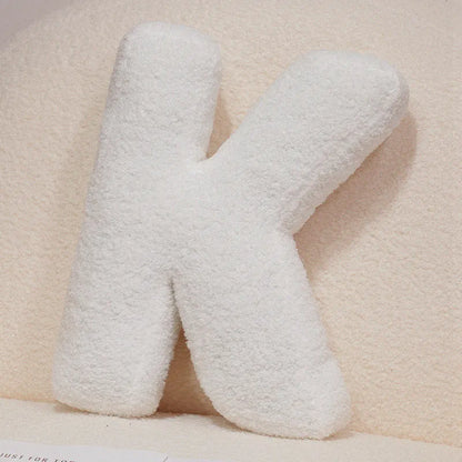 Coussin en peluche en forme de lettre de l'alphabet