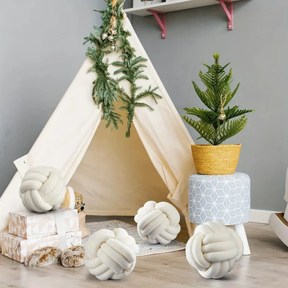 Oreiller en peluche à nœud tissé